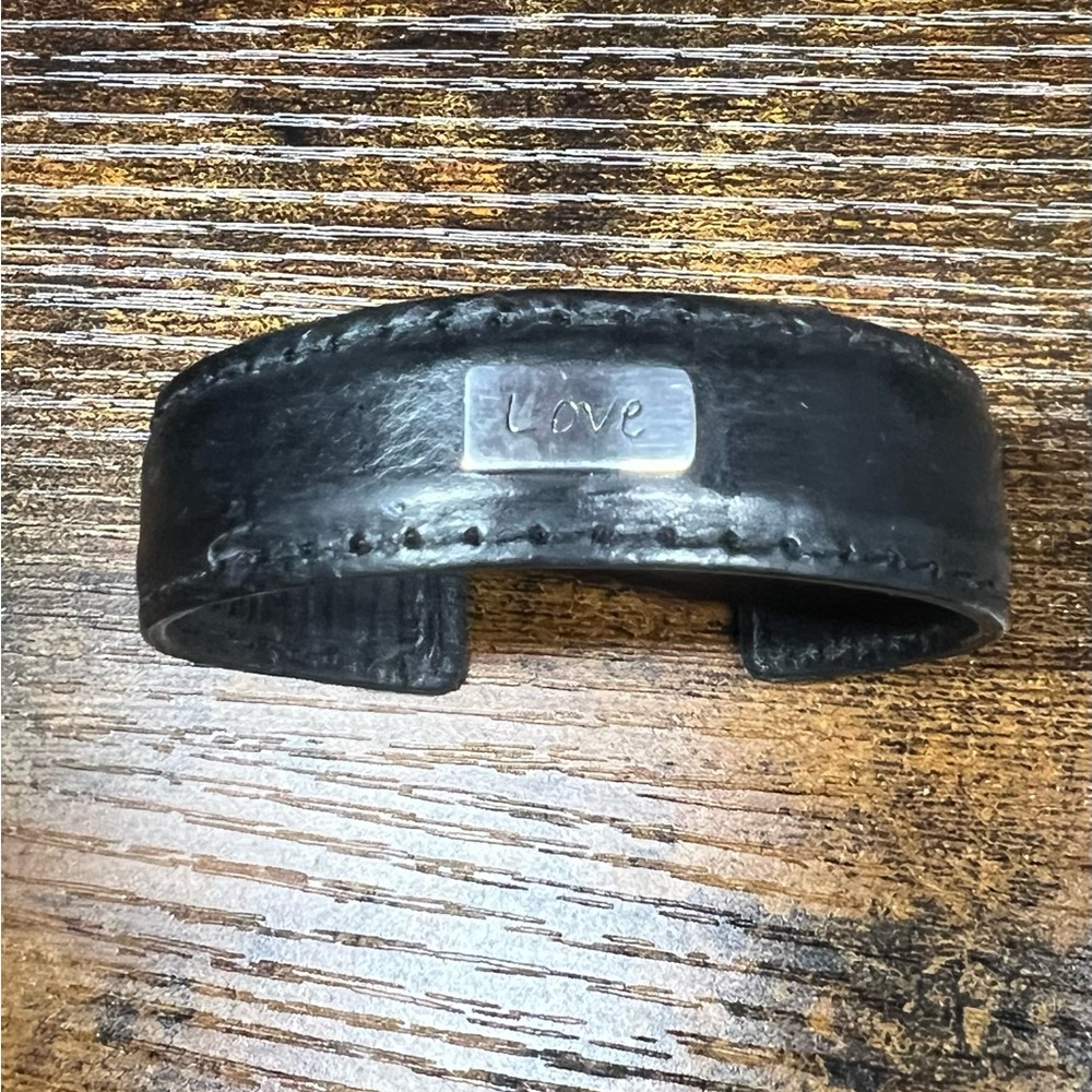 Black Leather Cuff Bracelet
 Has a steel base, can adjust